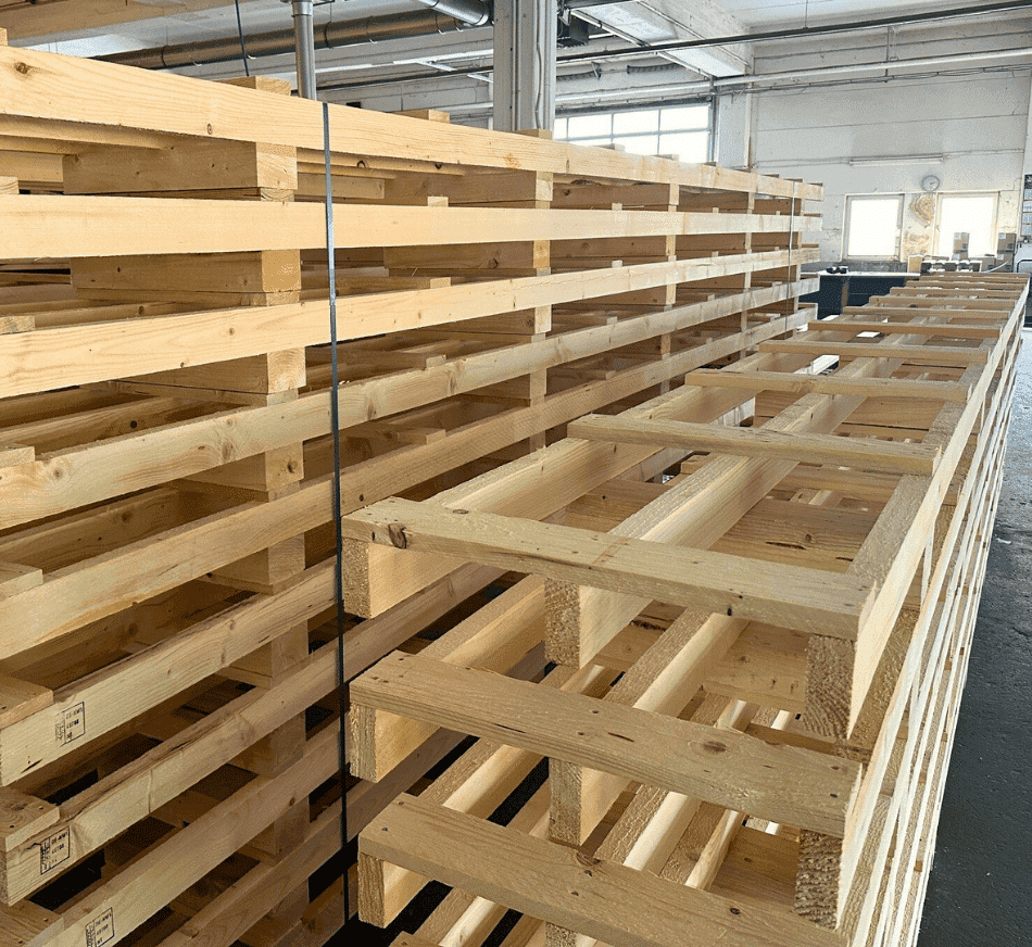 Stacked wooden pallets for shipping and storage at PalletBiz warehouse.