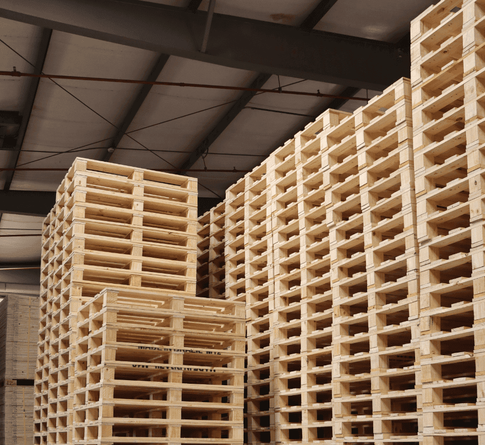 Pallets stacked for industrial storage and transportation in a warehouse.