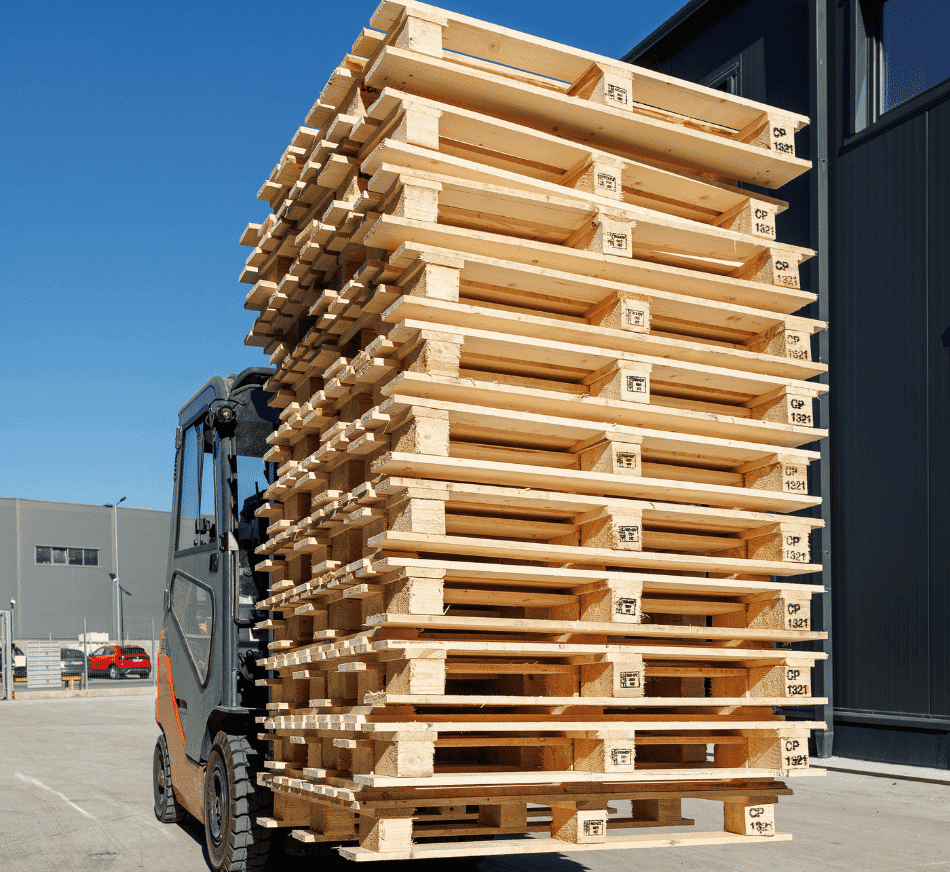 High-resolution image of stacked wooden pallets loaded on forklift, ideal for storage, shipping, and logistics industries.