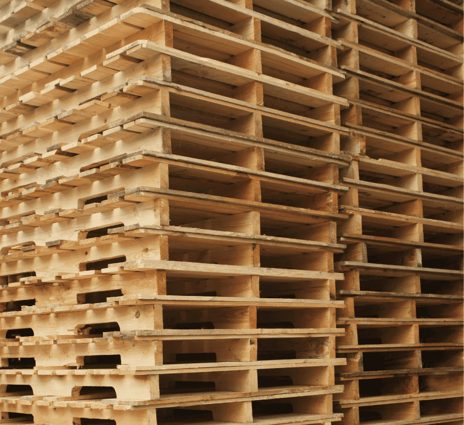 Stacked wooden pallets ready for transportation.