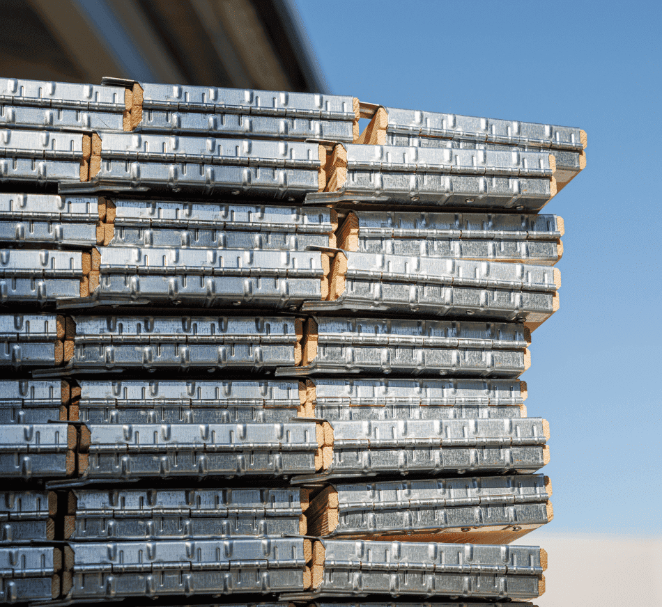 Folded pallet collars stacked outdoors, ready for freight shipping.