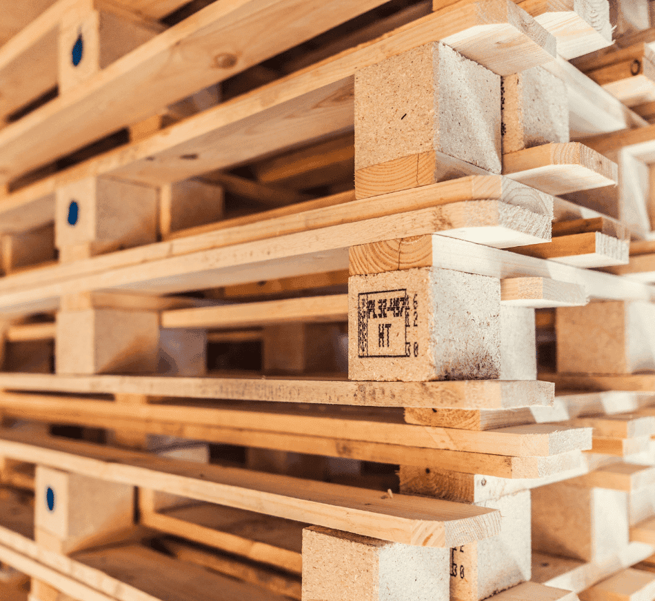 Stacks of wooden pallets and crates for logistics and transportation.
