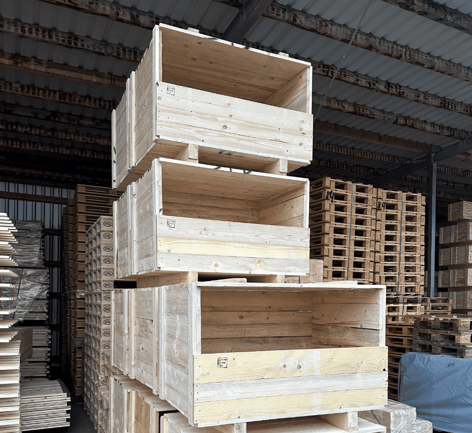 Stacked wooden pallets and crates in a warehouse for storage and transportation.