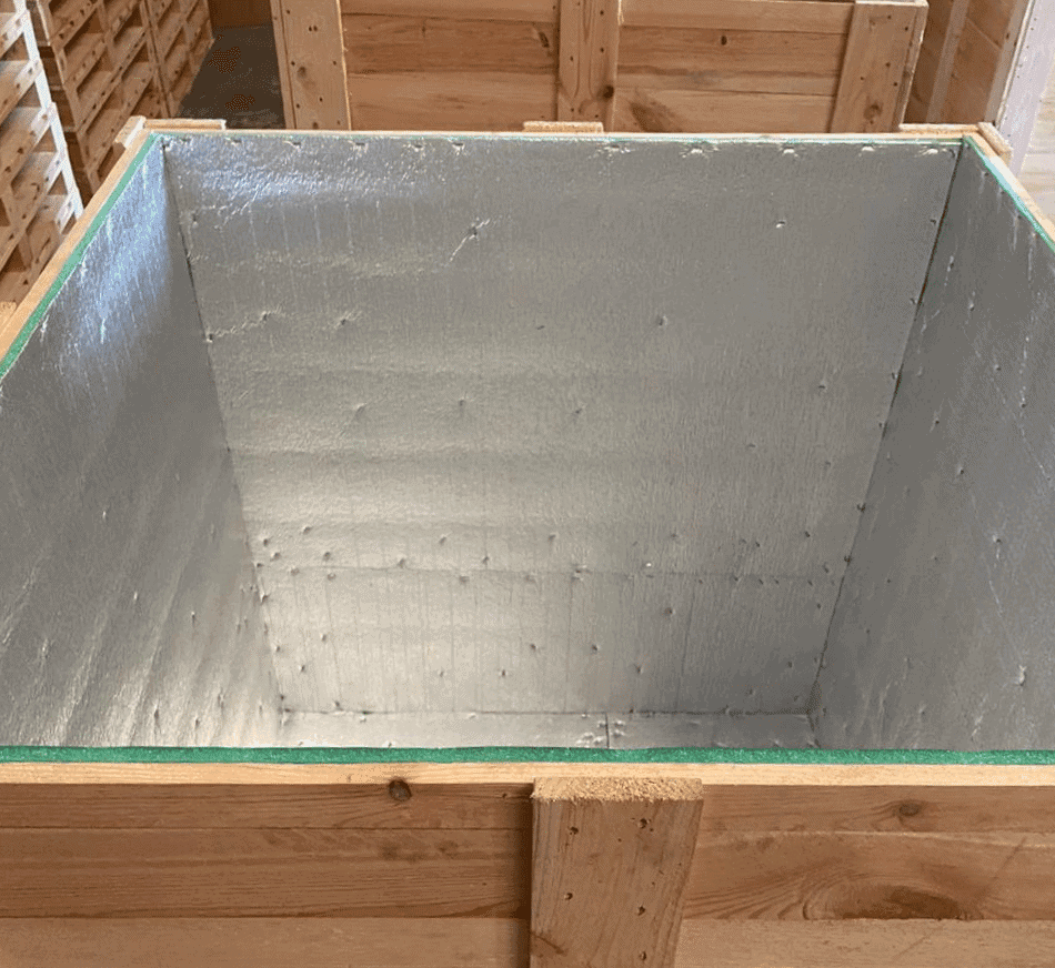 Insulated wooden box with reflective surface for moisture-sensitive logistics.