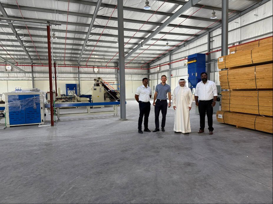4 men standing in the PalletBiz Oman warehouse